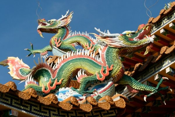 The figure of a dragon on the roof of a Chinese temple
