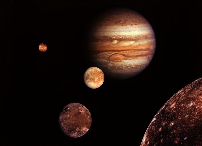 The moons of Jupiter, named after Galileo, orbiting their parent planet. Galileo viewed these moons as a smaller Copernican system within the Solar system and used them to support Heliocentrism