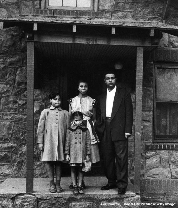 Linda Brown with parents Leola and Oliver and little sister Terry in front of their house