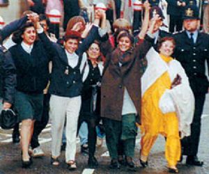 Kiranjit Ahluwalia (in white trousers) with her supporters outside the Central Criminal Court of England and Wales