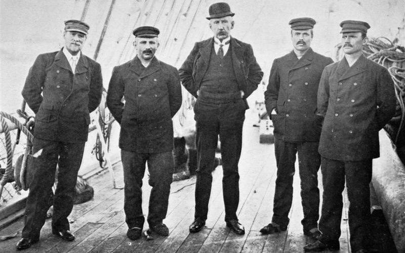 Members of the party who reached the South Pole. From left- Hassel, Wisting, Captain Amundsen, Bjaaland, Hanren
