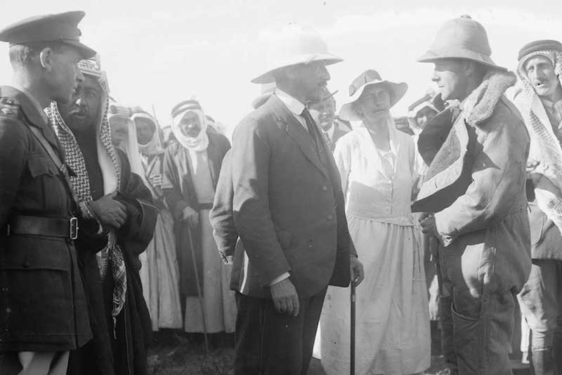 Gertrude Bell looks on as Sir Herbert Samuel, the British high commissioner in Palestine, greets a pilot in Jordan in 1921