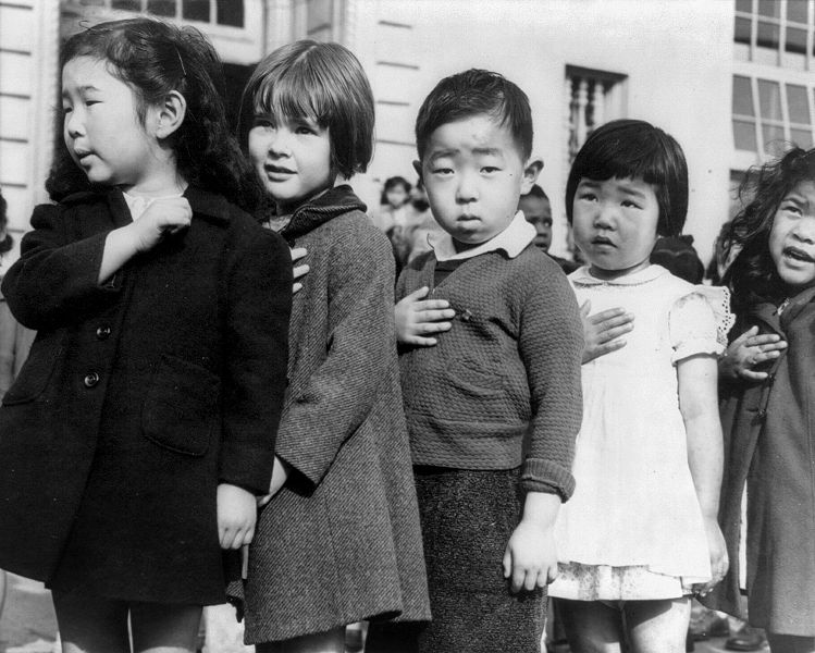 Children at the Weill public school in San Francisco pledge allegiance to the American flag in April 1942, prior to the internment of Japanese Americans