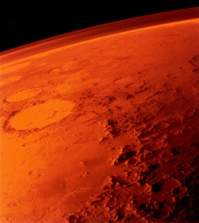 The tenuous atmosphere of Mars visible on the horizon