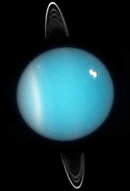 Uranus in 2005. Rings, southern collar and a bright cloud in the northern hemisphere are visible (HST ACS image)