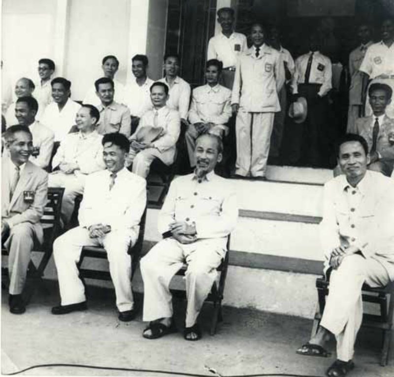 Hồ Chí Minh watching a soccer game in his favourite fashion. His closest comrade - Prime Minister Pham Van Dong is the person sitting next to him on the right corner.