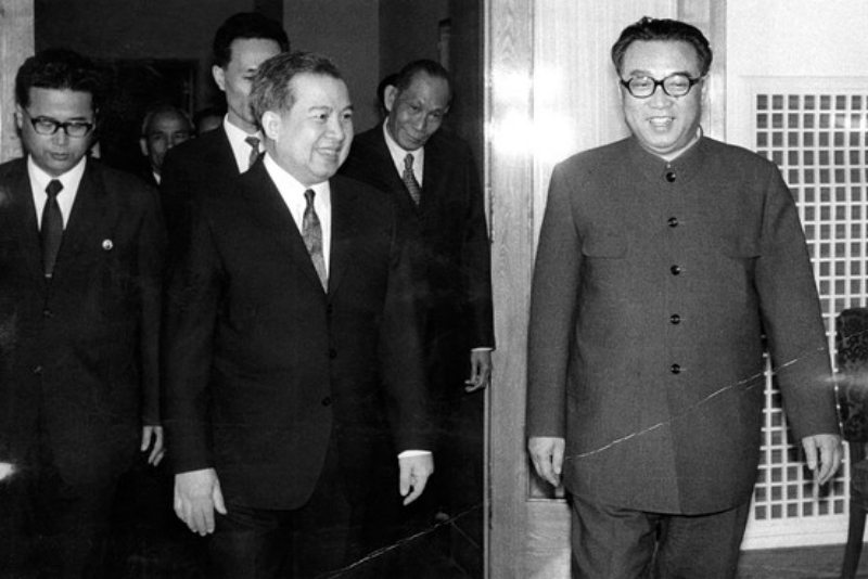 This 1975 photo shows Norodom Sihanouk, Cambodia’s head of state in exile, meeting with then-North Korean President Kim Il. Credit: Getty Images
